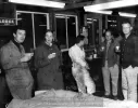 image for Left to right: Bob Winkelmann, ???, ???, Jim Beam, Nadeau Bourgeault, Mogens Skov (beyond), and Bill Breeze celebrate in the office at the Sports Car Center, Manzanita, about 1959.  Photo credit Stephen Holman